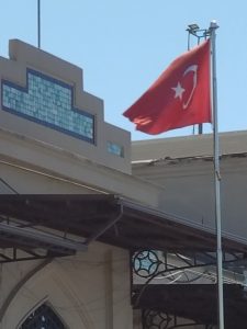 The white crescent and star on the red background of the Turkish flag
