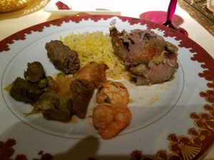 Whole roasted lamb with saffron rice, chicken and shrimp tagine and vegetables as the main course